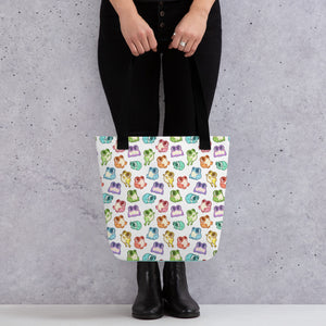 Person standing behind a large Friendly Frogs Tote from Bindlewood Shop on spun polyester weather-resistant fabric, holding the bag by its handles against a grey background.