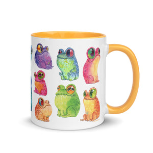 A vibrant, colorfully illustrated ceramic Frog Frenzy Mug adorned with whimsical drawings of Chris Ryniak watercolor frog paintings in various poses and expressions from Bindlewood Shop.