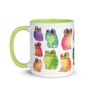 A vibrant ceramic Frog Frenzy Mug adorned with colorful whimsical illustrations of frogs in various hues and poses, featuring prints to order from Chris Ryniak's watercolor frog paintings at Bindlewood Shop.