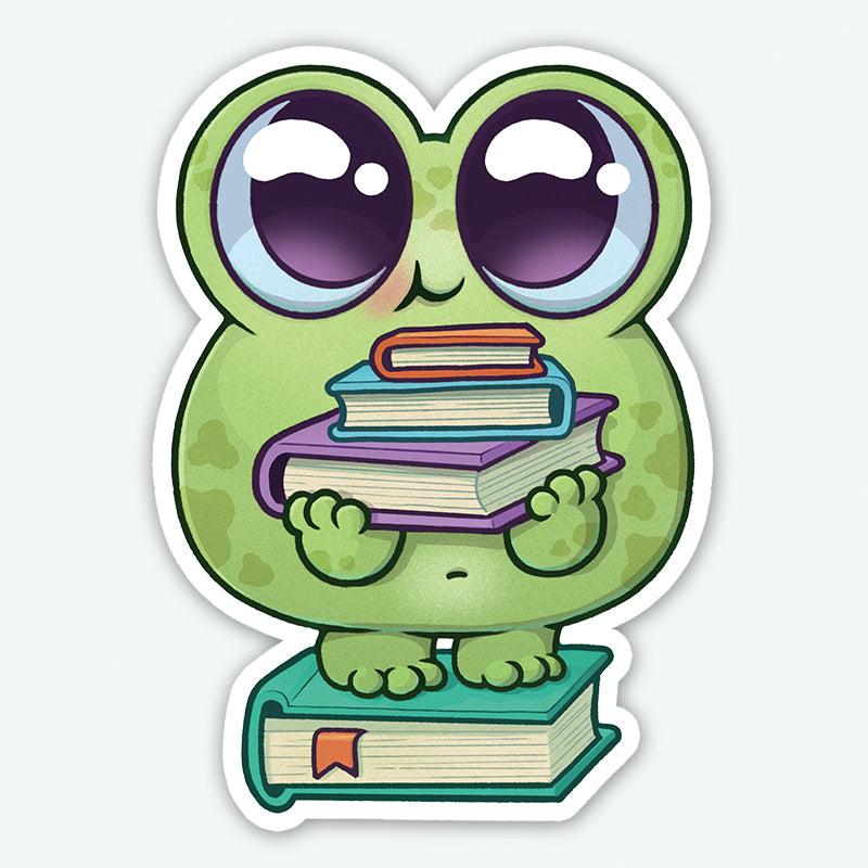 The READ-A-BIT Sticker by Bindlewood Shop features a cartoon frog with big eyes holding colorful books on a large book. This durable, matte-finish sticker adds charm to any surface.