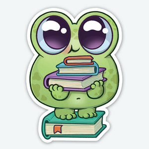 The READ-A-BIT Sticker by Bindlewood Shop showcases a cute cartoon frog with large, shiny eyes holding a stack of colorful books against its chest. The frog stands atop another book in a playful and whimsical design. This high-quality vinyl sticker features a durable matte finish that perfectly complements its charming appeal.