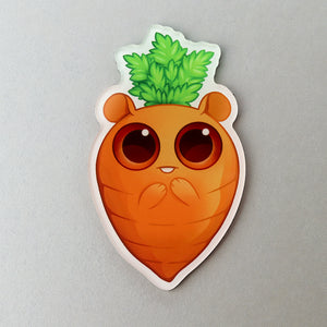 An adorable "Carrot" Acrylic Magnet featuring a cute creature designed by Amanda Spayd and Chris Ryniak, with big eyes and a tuft of green leaves on its head from Bindlewood Shop.