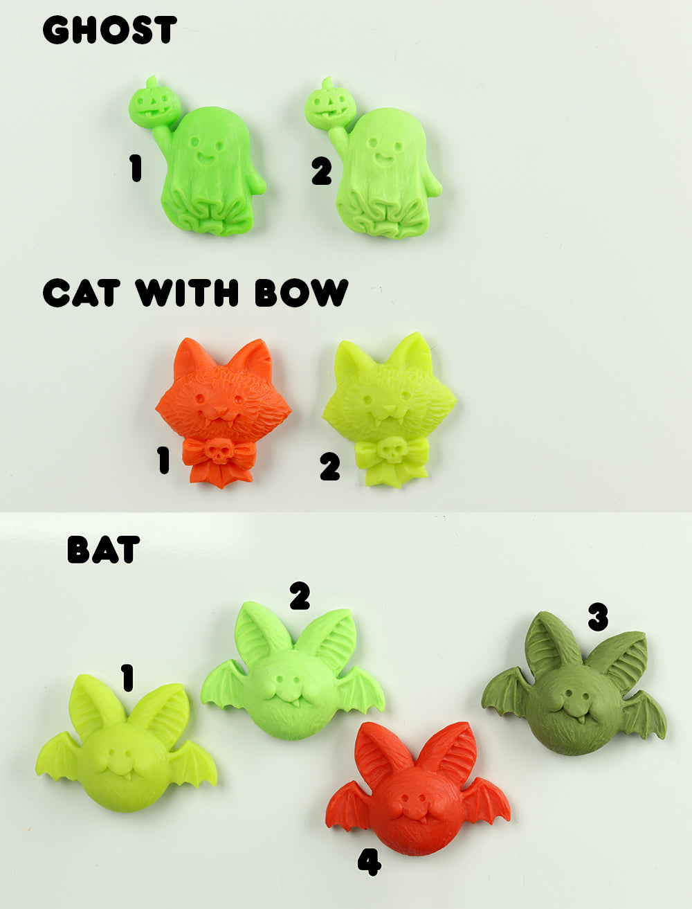 Set of Halloween-themed magnets including ghost, cat with bow, and bat on a white background.