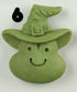 The Bindlewood Shop Halloween Magnets feature a hand-sculpted green clay smiling face with a pointed witch hat and buckle, accented by a bold black number 6 near the top left corner.
