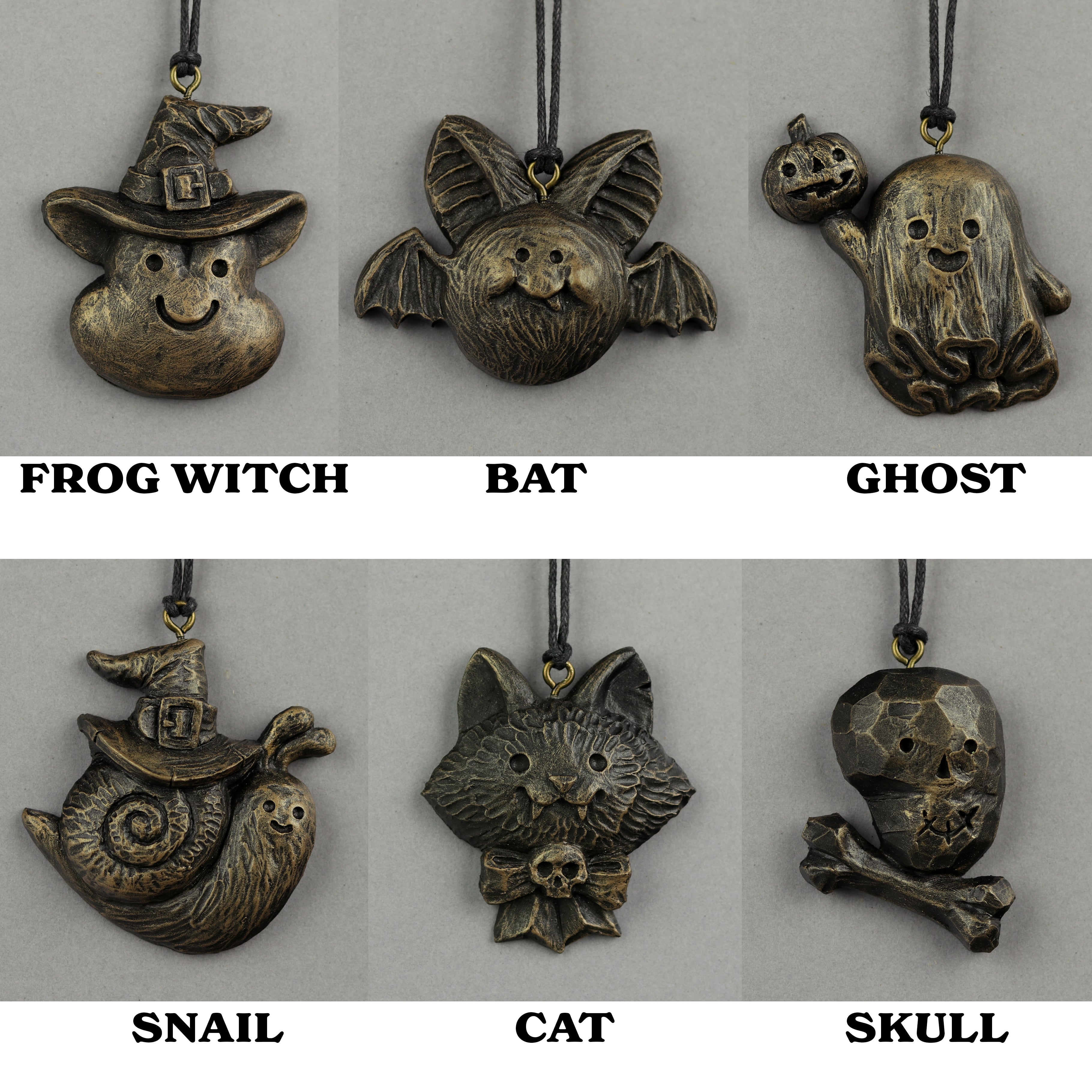 Set of six bronze-colored Painted Mini Ornaments by Bindlewood Shop: witch with hat, bat, ghost with pumpkin, snail with witch hat, cat with skull bow, and skull with crossbones—spooky Chris Ryniak-inspired designs.