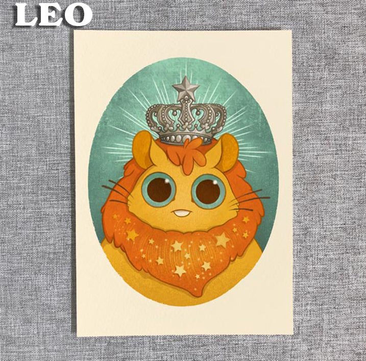 From Bindlewood Shop's Zodiac Prints by Amanda Louise Spayd: a cute cartoon lion with a jeweled crown and starry mane in an oval frame on textured gray, “LEO” in bold white—ideal as a fine art print on archival paper.
