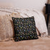 The Moth Magic Throw Pillow by Bindlewood Shop features vibrant botanical and moon designs, shown on a beige textured rug with a woven cushion and striped blanket draped over the bed.