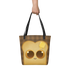 A hand holds the Toast-Bag Tote by Bindlewood Shop, a durable bag with black straps featuring a cute cartoon toast with big eyes and melting butter on its head, set on a brown checkered background.