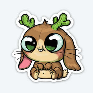 The Bindlewood Shop Cactalope Sticker (3-inch) features a cute cartoon bunny with big green eyes, tiny paws, and cacti antlers. Its floppy ear and round belly make it perfect as a matte vinyl sticker for any collection.