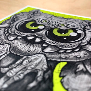 Close-up of a striking black and white illustration with vibrant lime green accents, showcasing intricate detailing and a pair of captivating, large, circular eyes dominating the composition by Chris Ryniak's "Eyegurr" Print.