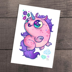 A whimsical illustration of a round, pink unicorn with a colorful mane, sparkling eyes, and playful bubbles from Thimblestump Hollow, set against a wooden background. Chris Ryniak's "Floofy Unicorn Magic" Print.