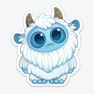 A cute Yeti Cryptid Sticker from Bindlewood Shop of a fluffy monster with big blue eyes, small horns, and a thick white fur coat. It has an endearing expression and is outlined with a white border.