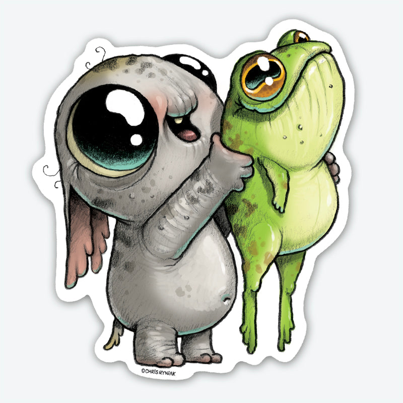 The Look What I Caught Sticker from Bindlewood Shop features a big-eyed gray bunny holding a wide-eyed green frog, both with playful cartoon expressions, on a durable matte vinyl sticker.