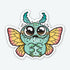 The MothPup Sticker from Bindlewood Shop is a cartoon-style vinyl sticker featuring a cute, mint-green bug with big shiny eyes, yellow-pink wings, teal antennae, tiny claws, and a sad expression on its chubby body in a matte finish.