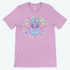 The Pastel Candy Bat Tee by Bindlewood Shop features cute pastel bats, stars, candies, and ghosts. This kawaii lavender t-shirt offers a gender-neutral fit—perfect for anyone who loves adorable fashion!.