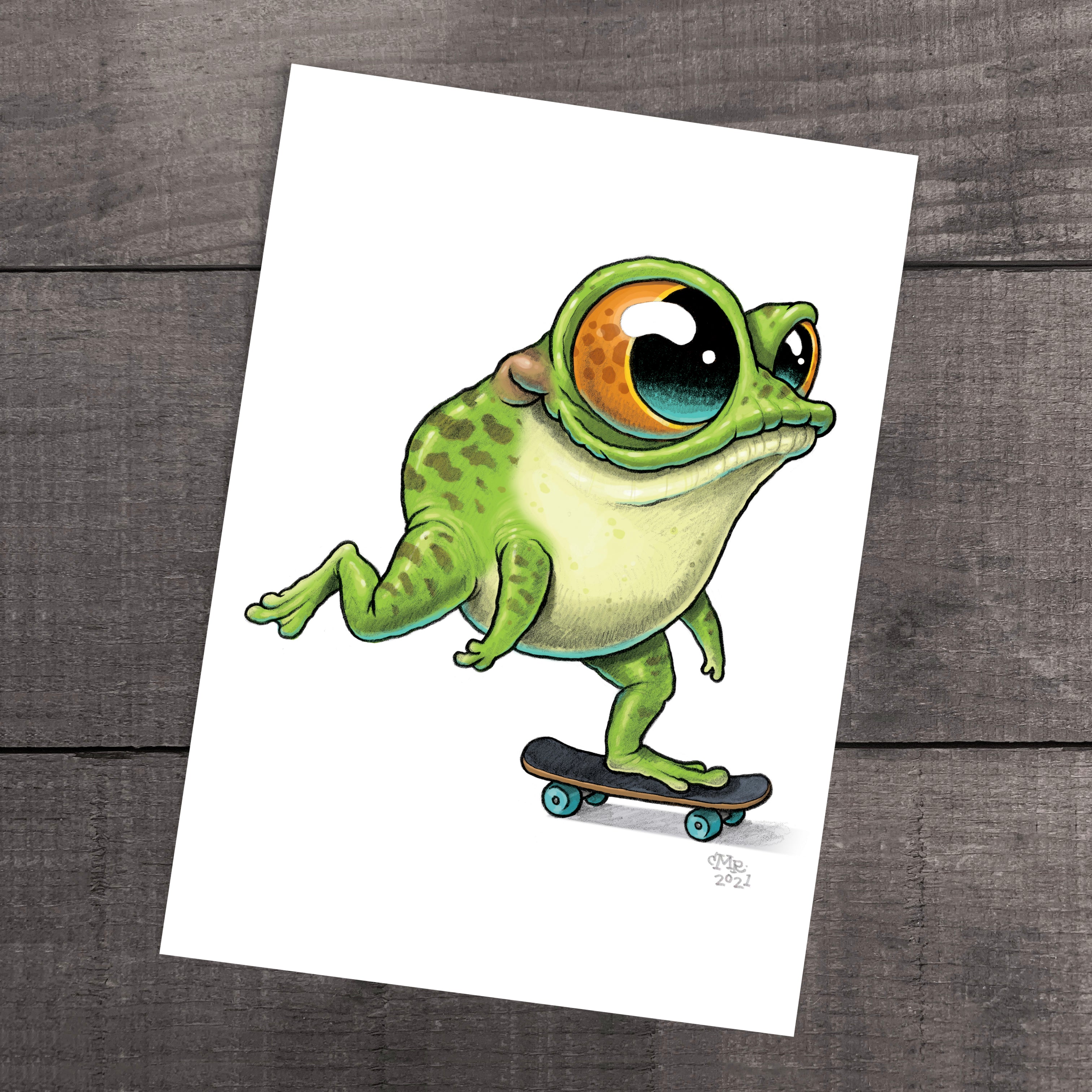 An illustrated "Skater Frog" print with oversized eyes skateboarding on a wooden floor, inspired by the whimsical world of Thimblestump Hollow by Chris Ryniak.