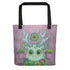 The Libra Tote from Bindlewood Shop features a cute green deer with leafy antlers, succulents on its head and chest, and two pink pots hanging from its antlers—all set against a textured purple background.