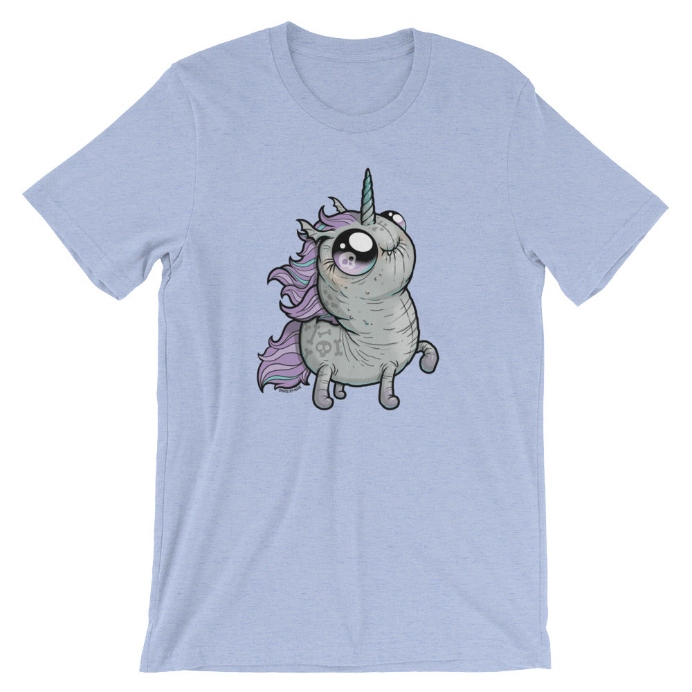 A light blue Goth Ponycorn Tee from Bindlewood Shop featuring a whimsical illustration of a chubby, wide-eyed unicorn with a purple mane and small wings. The unicorn stands upright with a happy expression, adding a playful and cute touch to the design. Made from high-quality fabric, it offers a comfortable, gender-neutral fit.