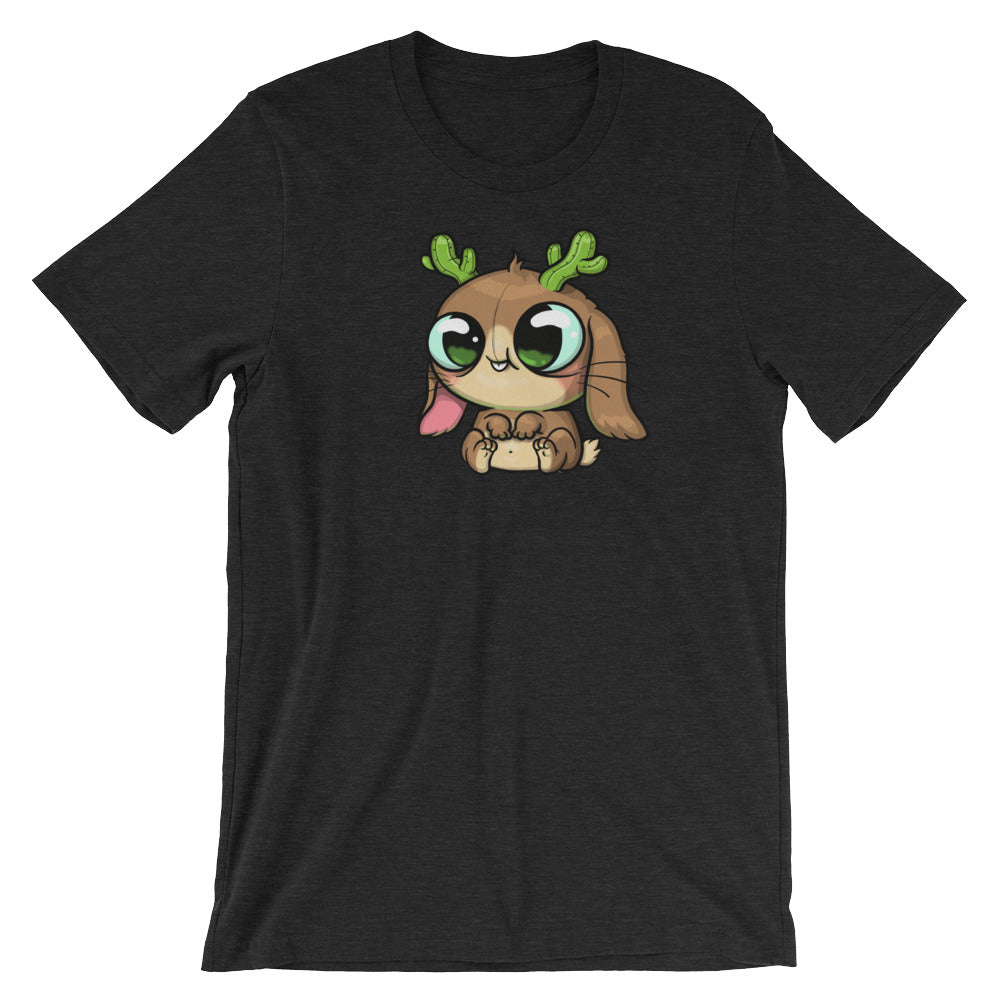 Introducing the Cactalope Tee from Bindlewood Shop: a black T-shirt featuring an adorable cartoon character inspired by Chris Ryniak's Cactalope. This charming design showcases big eyes and small green antlers, with the playful character sitting happily, its tongue sticking out, combining elements of a dog and reindeer. Its gender-neutral fit ensures comfort for everyone.
