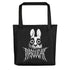 The Bindlewood Shop's "Black Metal Pipsqueak Tote" in rugged black cotton denim features a stylized rabbit with exaggerated eyes and distressed fur, with "MISOGEAR" in jagged lettering below. Ideal for dark side enthusiasts, it includes durable black straps for your adventures.