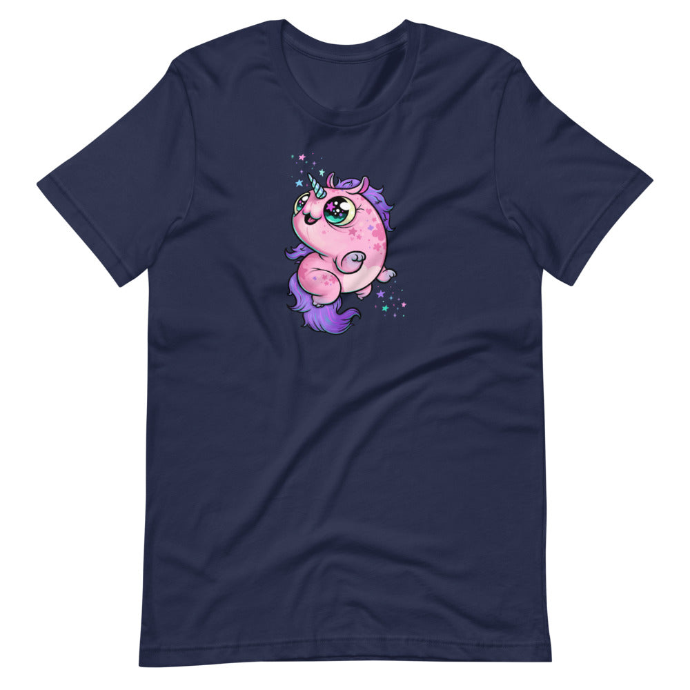 A navy blue, gender-neutral fit t-shirt featuring Chris Ryniak's Flooficorn—a cute, chubby pink unicorn with large, sparkling eyes and a lavender mane and tail. The unicorn is surrounded by colorful sparkles and stars, adding a whimsical touch to this cozy shirt design. This is the Floofy Unicorn Magic Tee from Bindlewood Shop.