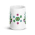 The Succulent Mug from Bindlewood Shop is a white ceramic piece adorned with vibrant illustrations of green and purple succulents in pots featuring intricate geometric patterns. Dishwasher safe, this lively and artistic mug mesmerizes with its symmetrical arrangement.
