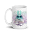 The So Many Books Mug by Bindlewood Shop features a wide-eyed rabbit wearing glasses, surrounded by stacks of colorful books against a backdrop of pastel hues. This ceramic mug is not only charming but also functional, being both microwave and dishwasher safe for convenient use and cleaning.