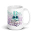 Introducing the So Many Books Mug by Bindlewood Shop: a white ceramic mug showcasing an adorable, cartoon-style turquoise creature with large eyes nestled among piles of books. The creature is depicted enjoying a book within a backdrop of soothing pastel gradients. This microwave and dishwasher-safe mug is an ideal choice for any enthusiastic book lover.